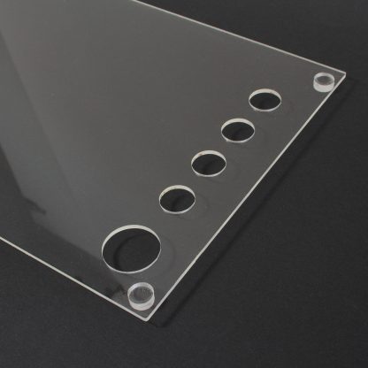 Detail of acrylic plexiglass dust cover with custom fitted holes for data wheel and qlinks.